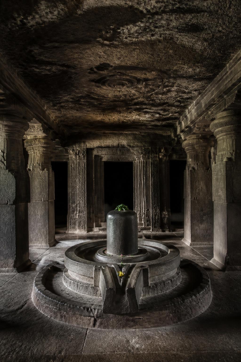 Rock-cut pillars and shrine chambers inside Pataleshwar Cave Temple.