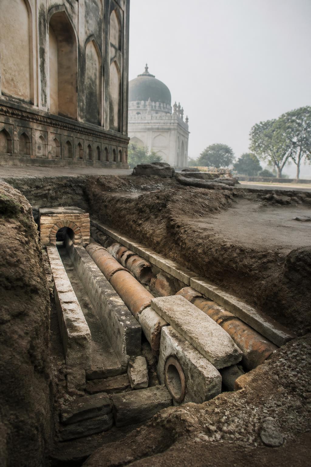 Excavated water channels and terracotta pipes at the heritage park.