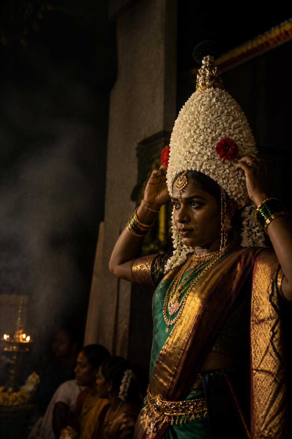 A Karaga priest in female ritual attire preparing for the procession.